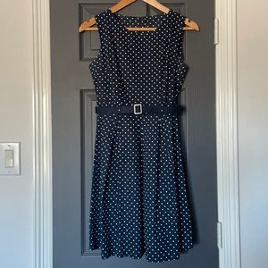 -vintage look navy dress with white dots and removable belt at waist